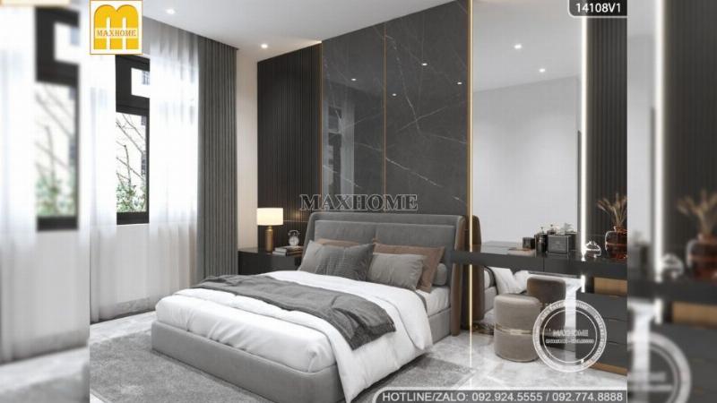 Thiết kế phòng ngủ master trong mẫu nhà cấp 4 3 phòng ngủ, tập trung vào sự tối giản, sử dụng tông màu ấm, giường lớn và ánh sáng dịu nhẹ để tạo không gian thư giãn